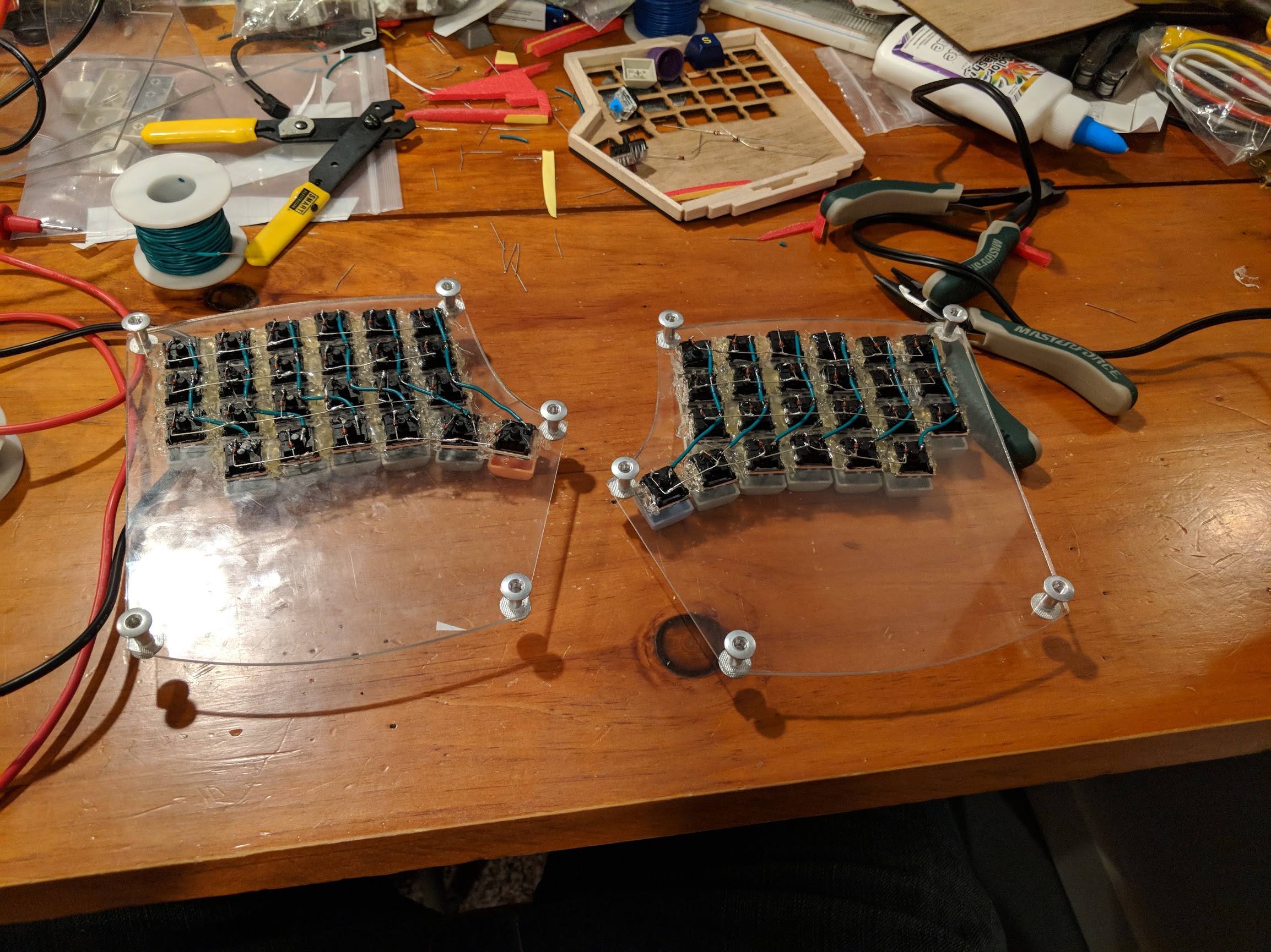 Bottom of transparent keyboard plates with row and column wiring diodes towards the rows